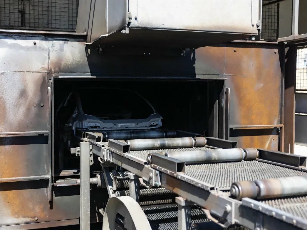 Automotive manufacturing curing oven with steel conveyors and moisture, illustrating where LF extended-range RFID tags outperform UHF by preventing signal reflections Automotive manufacturing curing oven with steel conveyors and moisture, illustrating where LF extended-range RFID tags outperform UHF by preventing signal reflections